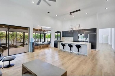 This fully renovated contemporary estate is nestled in the on Broken Sound Golf and Club  in Florida - for sale on GolfHomes.com, golf home, golf lot
