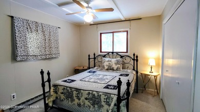 Escape to this cute-as-a-button 3-bedroom, 1-bath chalet with a on The Hideout Golf in Pennsylvania - for sale on GolfHomes.com, golf home, golf lot