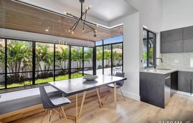 This fully renovated contemporary estate is nestled in the on Broken Sound Golf and Club  in Florida - for sale on GolfHomes.com, golf home, golf lot