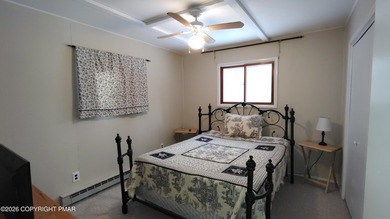 Escape to this cute-as-a-button 3-bedroom, 1-bath chalet with a on The Hideout Golf in Pennsylvania - for sale on GolfHomes.com, golf home, golf lot