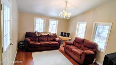 Escape to this cute-as-a-button 3-bedroom, 1-bath chalet with a on The Hideout Golf in Pennsylvania - for sale on GolfHomes.com, golf home, golf lot