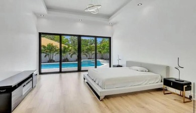 This fully renovated contemporary estate is nestled in the on Broken Sound Golf and Club  in Florida - for sale on GolfHomes.com, golf home, golf lot