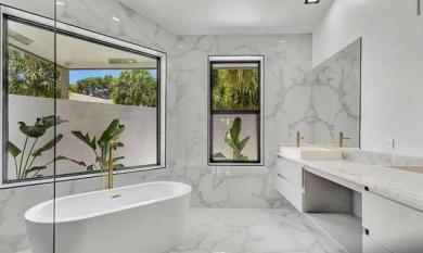 This fully renovated contemporary estate is nestled in the on Broken Sound Golf and Club  in Florida - for sale on GolfHomes.com, golf home, golf lot