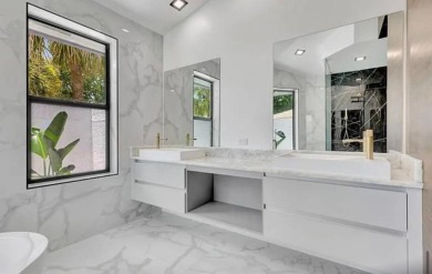 This fully renovated contemporary estate is nestled in the on Broken Sound Golf and Club  in Florida - for sale on GolfHomes.com, golf home, golf lot