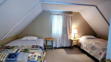 Escape to this cute-as-a-button 3-bedroom, 1-bath chalet with a on The Hideout Golf in Pennsylvania - for sale on GolfHomes.com, golf home, golf lot