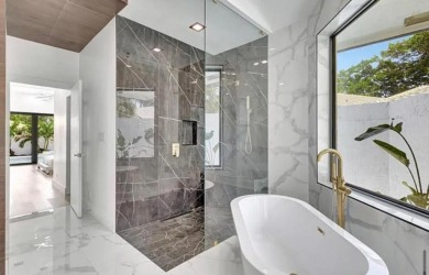 This fully renovated contemporary estate is nestled in the on Broken Sound Golf and Club  in Florida - for sale on GolfHomes.com, golf home, golf lot