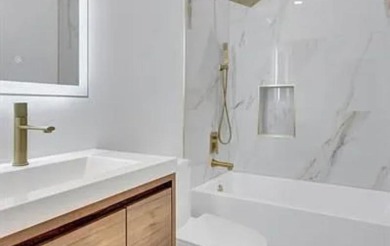 This fully renovated contemporary estate is nestled in the on Broken Sound Golf and Club  in Florida - for sale on GolfHomes.com, golf home, golf lot