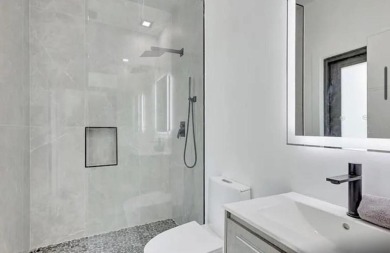 This fully renovated contemporary estate is nestled in the on Broken Sound Golf and Club  in Florida - for sale on GolfHomes.com, golf home, golf lot
