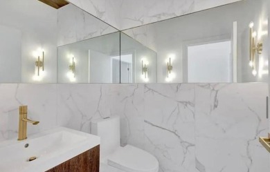 This fully renovated contemporary estate is nestled in the on Broken Sound Golf and Club  in Florida - for sale on GolfHomes.com, golf home, golf lot