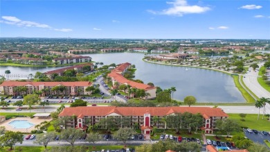 SPACIOUS UNIT WITH ACCORDIAN SHUTTERS AND A SCREENED BALCONY on Flamingo Lakes Country Club in Florida - for sale on GolfHomes.com, golf home, golf lot