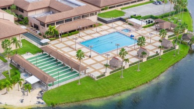 SPACIOUS UNIT WITH ACCORDIAN SHUTTERS AND A SCREENED BALCONY on Flamingo Lakes Country Club in Florida - for sale on GolfHomes.com, golf home, golf lot