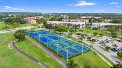 SPACIOUS UNIT WITH ACCORDIAN SHUTTERS AND A SCREENED BALCONY on Flamingo Lakes Country Club in Florida - for sale on GolfHomes.com, golf home, golf lot