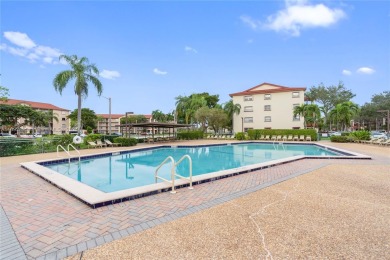 SPACIOUS UNIT WITH ACCORDIAN SHUTTERS AND A SCREENED BALCONY on Flamingo Lakes Country Club in Florida - for sale on GolfHomes.com, golf home, golf lot