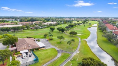 SPACIOUS UNIT WITH ACCORDIAN SHUTTERS AND A SCREENED BALCONY on Flamingo Lakes Country Club in Florida - for sale on GolfHomes.com, golf home, golf lot