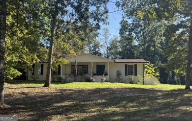 This sprawling brick ranch is in the perfect location! Minutes on Cherokee Golf and Country Club in Georgia - for sale on GolfHomes.com, golf home, golf lot