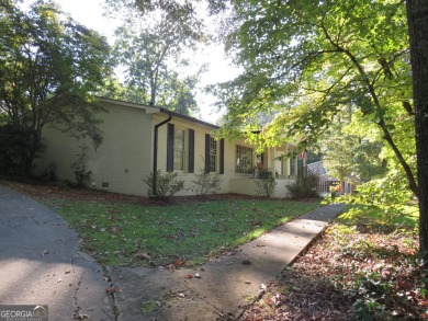 This sprawling brick ranch is in the perfect location! Minutes on Cherokee Golf and Country Club in Georgia - for sale on GolfHomes.com, golf home, golf lot