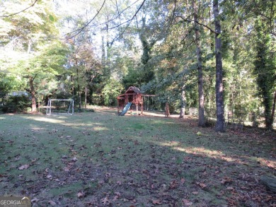 This sprawling brick ranch is in the perfect location! Minutes on Cherokee Golf and Country Club in Georgia - for sale on GolfHomes.com, golf home, golf lot