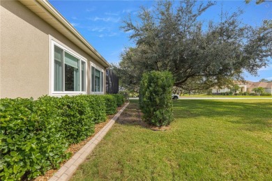 Welcome to this stunning Hampton floor plan home, located in the on Eagle Ridge At Spruce Creek Country Club in Florida - for sale on GolfHomes.com, golf home, golf lot