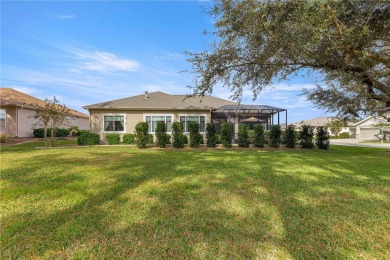 Welcome to this stunning Hampton floor plan home, located in the on Eagle Ridge At Spruce Creek Country Club in Florida - for sale on GolfHomes.com, golf home, golf lot