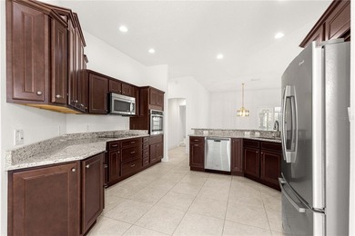 *LARGE GLASS ENCLOSED BONUS ROOM*FANTASTIC LOCATION*GOLF CART on Bella Glade Country Club in Florida - for sale on GolfHomes.com, golf home, golf lot