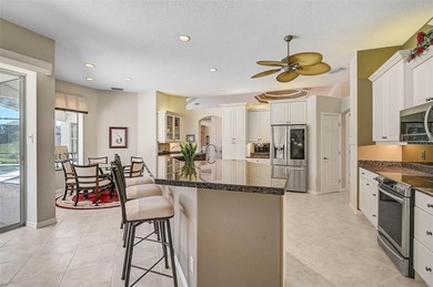 Discover refined living in this expansive Calusa Lakes estate on Calusa Lakes Golf Club in Florida - for sale on GolfHomes.com, golf home, golf lot