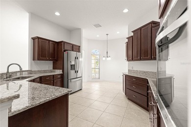 *LARGE GLASS ENCLOSED BONUS ROOM*FANTASTIC LOCATION*GOLF CART on Bella Glade Country Club in Florida - for sale on GolfHomes.com, golf home, golf lot