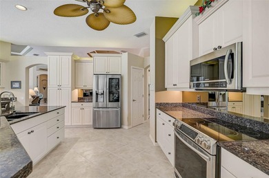 Discover refined living in this expansive Calusa Lakes estate on Calusa Lakes Golf Club in Florida - for sale on GolfHomes.com, golf home, golf lot