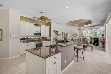 Discover refined living in this expansive Calusa Lakes estate on Calusa Lakes Golf Club in Florida - for sale on GolfHomes.com, golf home, golf lot