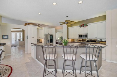 Discover refined living in this expansive Calusa Lakes estate on Calusa Lakes Golf Club in Florida - for sale on GolfHomes.com, golf home, golf lot