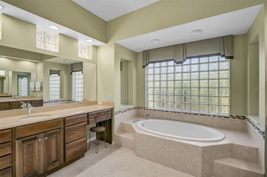 Discover refined living in this expansive Calusa Lakes estate on Calusa Lakes Golf Club in Florida - for sale on GolfHomes.com, golf home, golf lot