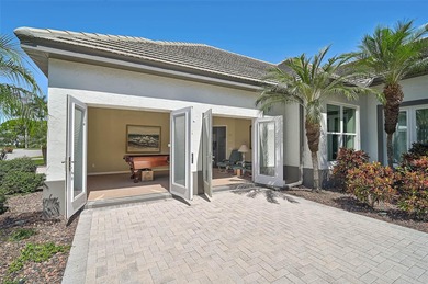 Discover refined living in this expansive Calusa Lakes estate on Calusa Lakes Golf Club in Florida - for sale on GolfHomes.com, golf home, golf lot