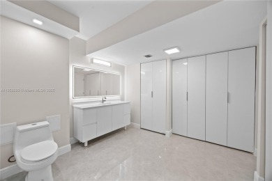 Step into this beautifully remodeled corner unit, where modern on Turnberry Isle Resort and Club in Florida - for sale on GolfHomes.com, golf home, golf lot
