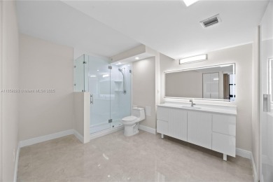 Step into this beautifully remodeled corner unit, where modern on Turnberry Isle Resort and Club in Florida - for sale on GolfHomes.com, golf home, golf lot