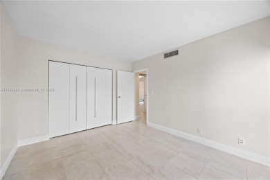 Step into this beautifully remodeled corner unit, where modern on Turnberry Isle Resort and Club in Florida - for sale on GolfHomes.com, golf home, golf lot