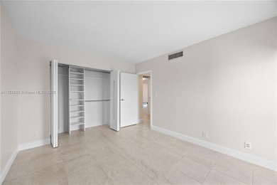 Step into this beautifully remodeled corner unit, where modern on Turnberry Isle Resort and Club in Florida - for sale on GolfHomes.com, golf home, golf lot