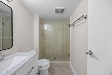 Step into this beautifully remodeled corner unit, where modern on Turnberry Isle Resort and Club in Florida - for sale on GolfHomes.com, golf home, golf lot