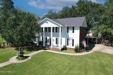 Discover this exquisite 4-bedroom home tucked away in on Diamondhead Country Club in Mississippi - for sale on GolfHomes.com, golf home, golf lot