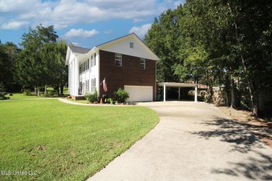 Discover this exquisite 4-bedroom home tucked away in on Diamondhead Country Club in Mississippi - for sale on GolfHomes.com, golf home, golf lot