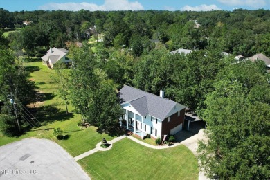 Discover this exquisite 4-bedroom home tucked away in on Diamondhead Country Club in Mississippi - for sale on GolfHomes.com, golf home, golf lot