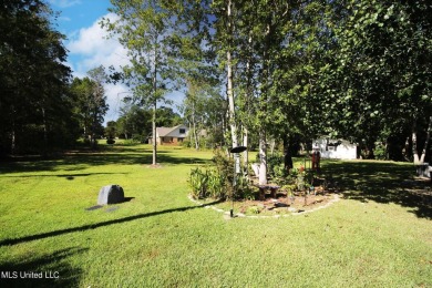 Discover this exquisite 4-bedroom home tucked away in on Diamondhead Country Club in Mississippi - for sale on GolfHomes.com, golf home, golf lot