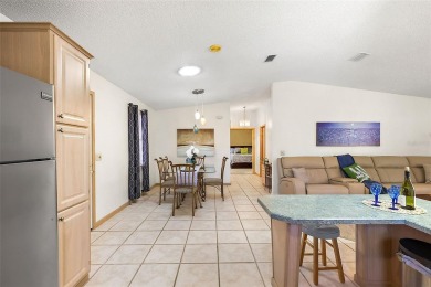 Feel Cozy in this CEDAR KEY model with BOND PAID situated in the on El Diablo Executive Golf Course in Florida - for sale on GolfHomes.com, golf home, golf lot