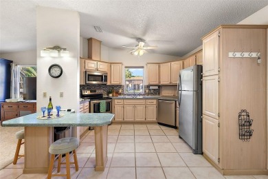 Feel Cozy in this CEDAR KEY model with BOND PAID situated in the on El Diablo Executive Golf Course in Florida - for sale on GolfHomes.com, golf home, golf lot