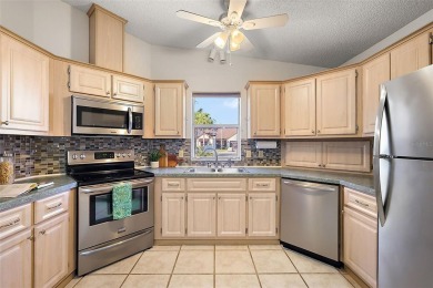 Feel Cozy in this CEDAR KEY model with BOND PAID situated in the on El Diablo Executive Golf Course in Florida - for sale on GolfHomes.com, golf home, golf lot