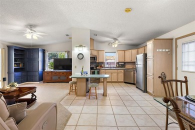 Feel Cozy in this CEDAR KEY model with BOND PAID situated in the on El Diablo Executive Golf Course in Florida - for sale on GolfHomes.com, golf home, golf lot
