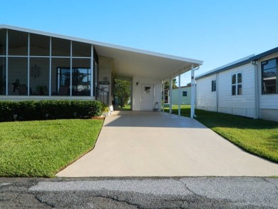 Stunning and updated, this 1,008 sq. ft. (28x36) 1983 Redman on Grasslands Golf and Country Club in Florida - for sale on GolfHomes.com, golf home, golf lot