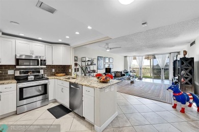 This fully remodeled unit features an open kitchen with white on Palm-Aire Country Club and Resort - Palms in Florida - for sale on GolfHomes.com, golf home, golf lot