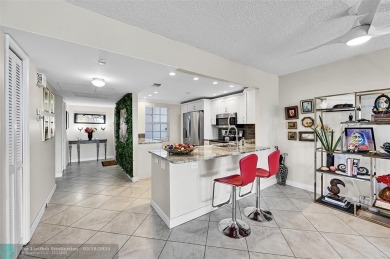 This fully remodeled unit features an open kitchen with white on Palm-Aire Country Club and Resort - Palms in Florida - for sale on GolfHomes.com, golf home, golf lot