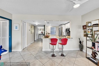This fully remodeled unit features an open kitchen with white on Palm-Aire Country Club and Resort - Palms in Florida - for sale on GolfHomes.com, golf home, golf lot