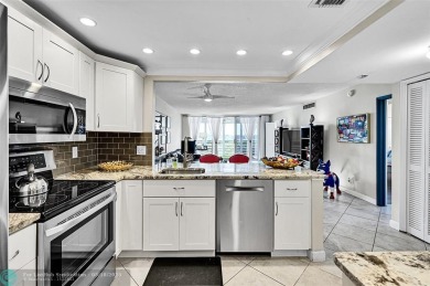 This fully remodeled unit features an open kitchen with white on Palm-Aire Country Club and Resort - Palms in Florida - for sale on GolfHomes.com, golf home, golf lot
