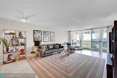 This fully remodeled unit features an open kitchen with white on Palm-Aire Country Club and Resort - Palms in Florida - for sale on GolfHomes.com, golf home, golf lot